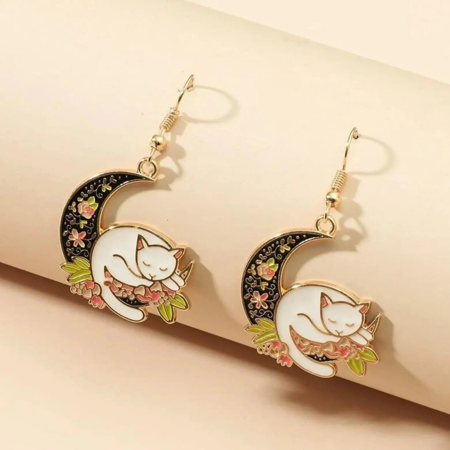 Cat Moon Dangle & Drop Earrings with sleeping cat on floral moon design in pink, gold, and silver tones.